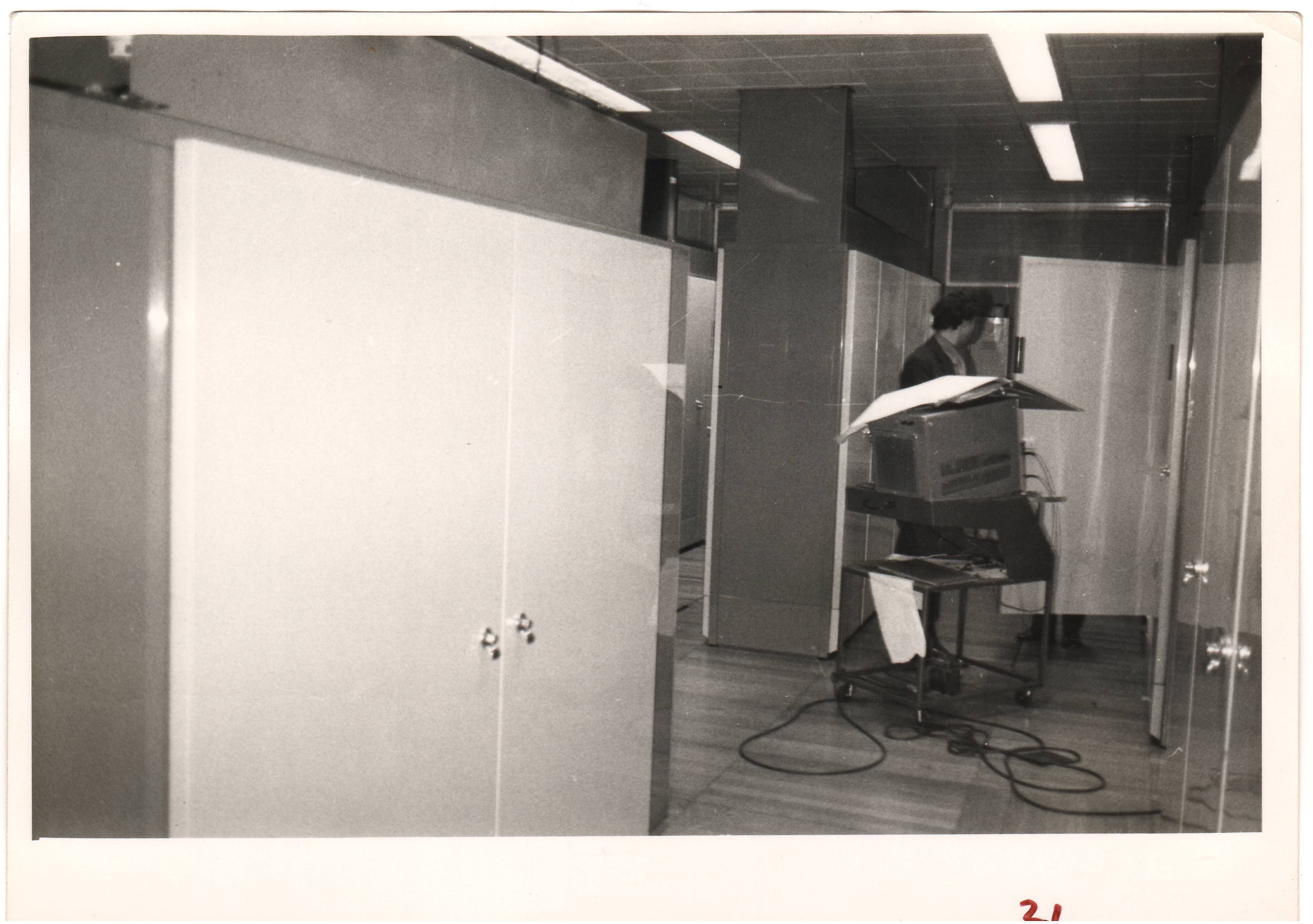 An Oscilloscope and it's trolley (see http://www.cs.man.ac.uk/CCS/res/res49.htm#g) in amongst the processor cabinets in the basement.
