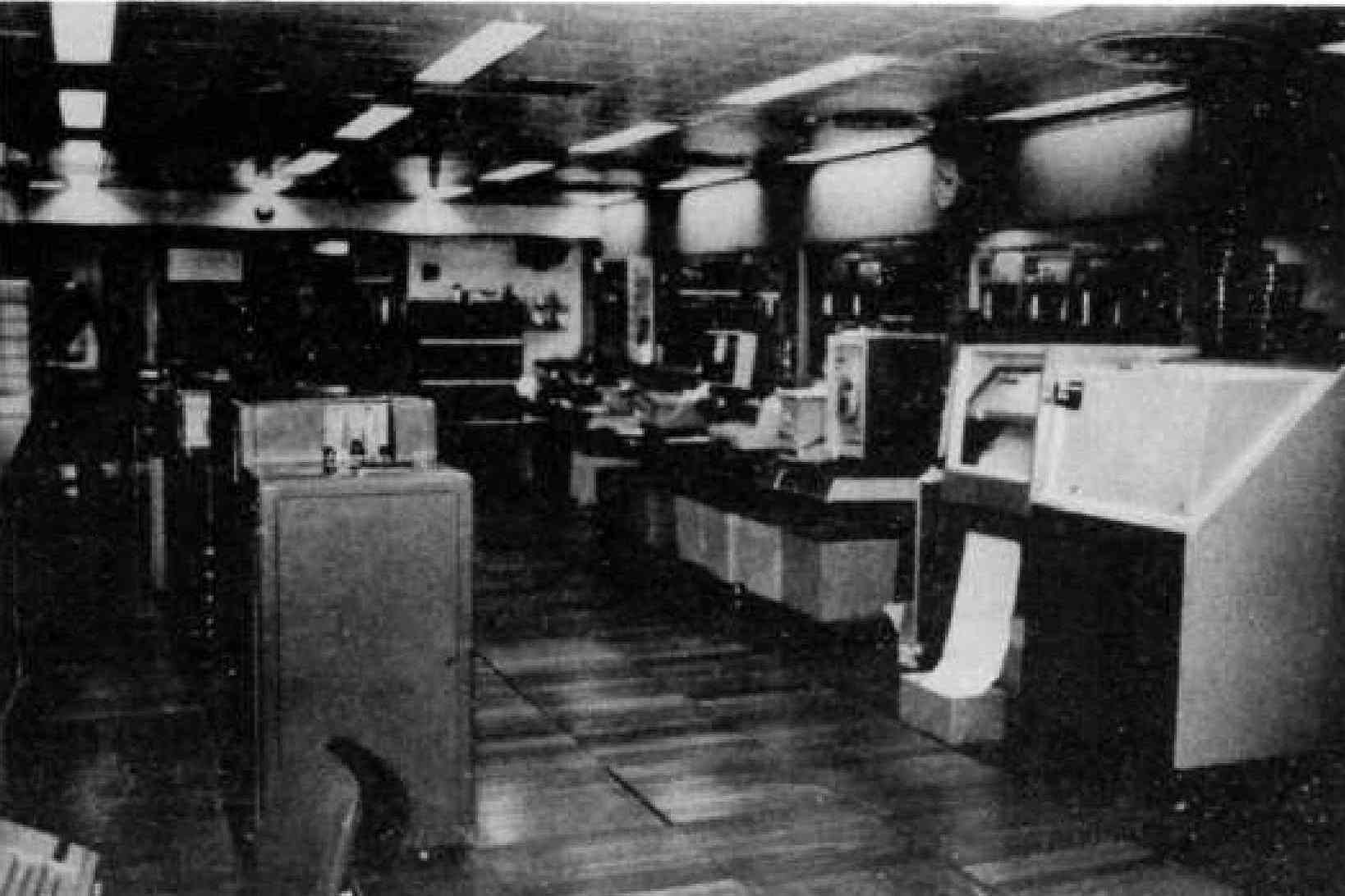 Fig 8: Another view of the computer room with one of the Anelex printers,  the magnetic tape in the back ground, and card readers and punches  to the left 