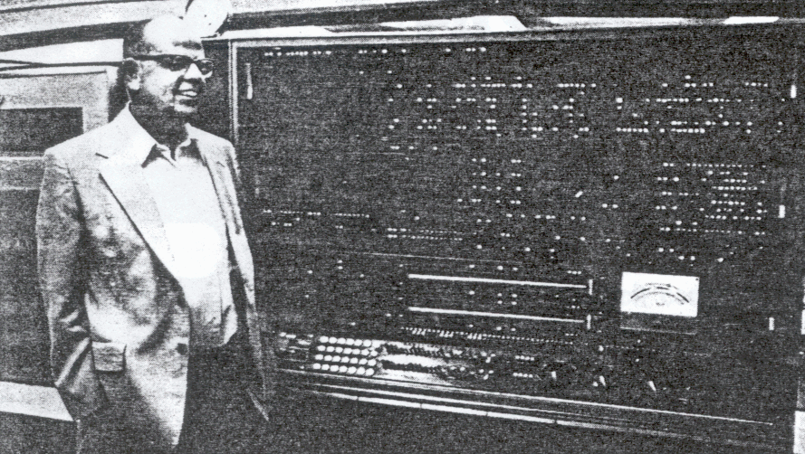 DR GARY CARLSON, who approved BYU's Stretch acquisition in 1971, stands in front of the maintenance panel, which had more than 3,000 lights. About three or four of the bulbs burned out each day. 
