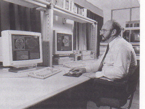 Figure 3. View of the design area:  this shows the working areas for the TOPAZ3 screen and the DECstation workstation.