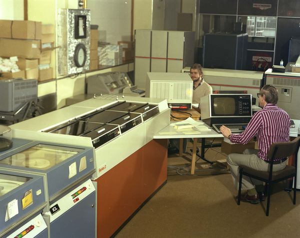 Mike Claringbold and the 2904 Development System, Terry Dunwoody in the background, March 1980