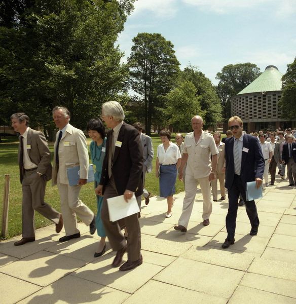 Alvey Conference, Sussex, Left to Right: Tony Dignan (Ferranti), Mike Falla (Software Sciences), Hui Chiu and Mike Russell (RAL) who were part of the Software Engineering team run by David Talbot and Rob Witty. In the white suit behind is Geoffrey Pattie Minister for IT who took over from Kenneth Baker.