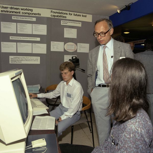 Cooperative Working Demonstrator at the Alvey Conference. Demonstrating to Peter Kirstein